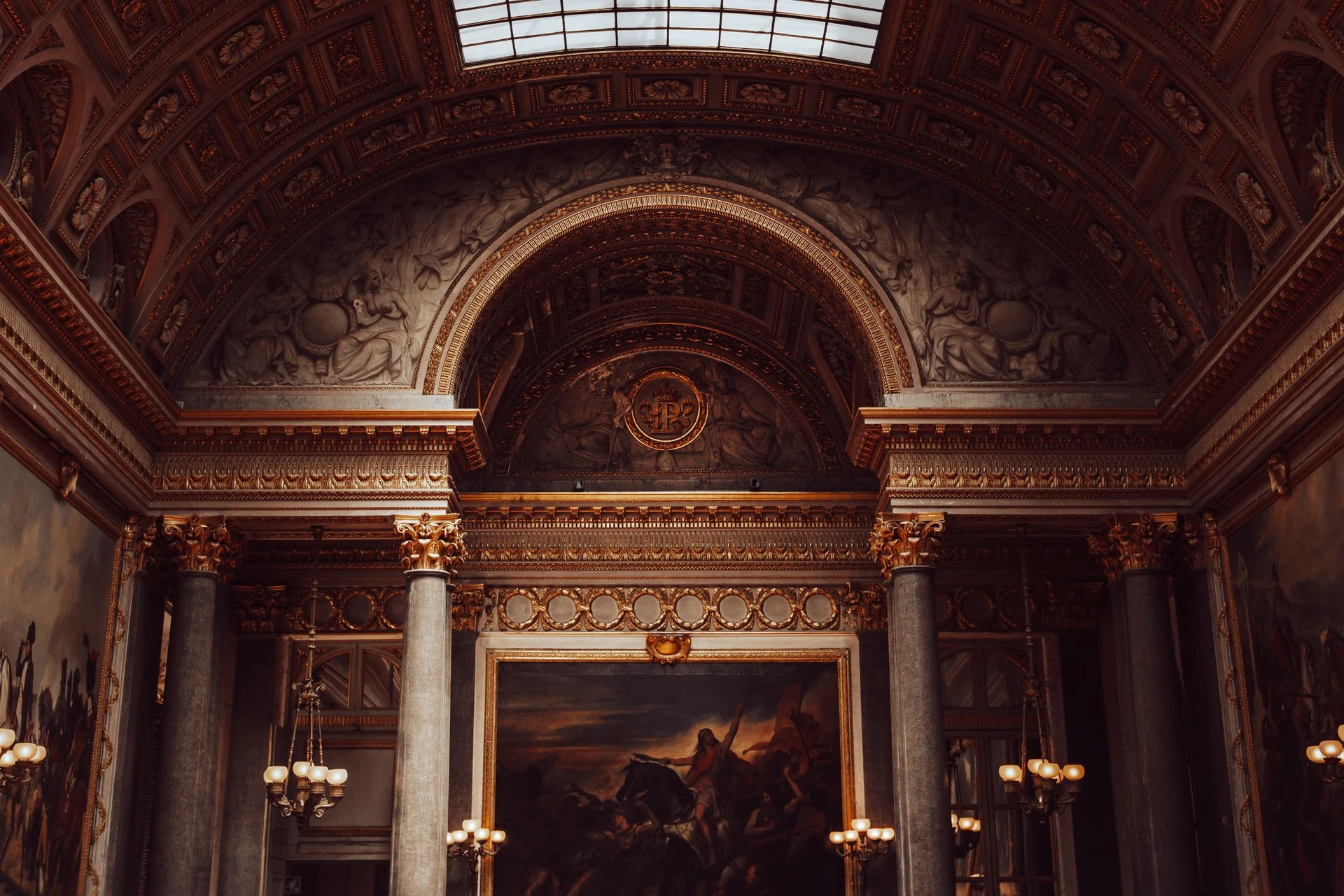 Carved fireplace and timber ceiling in a historic interior