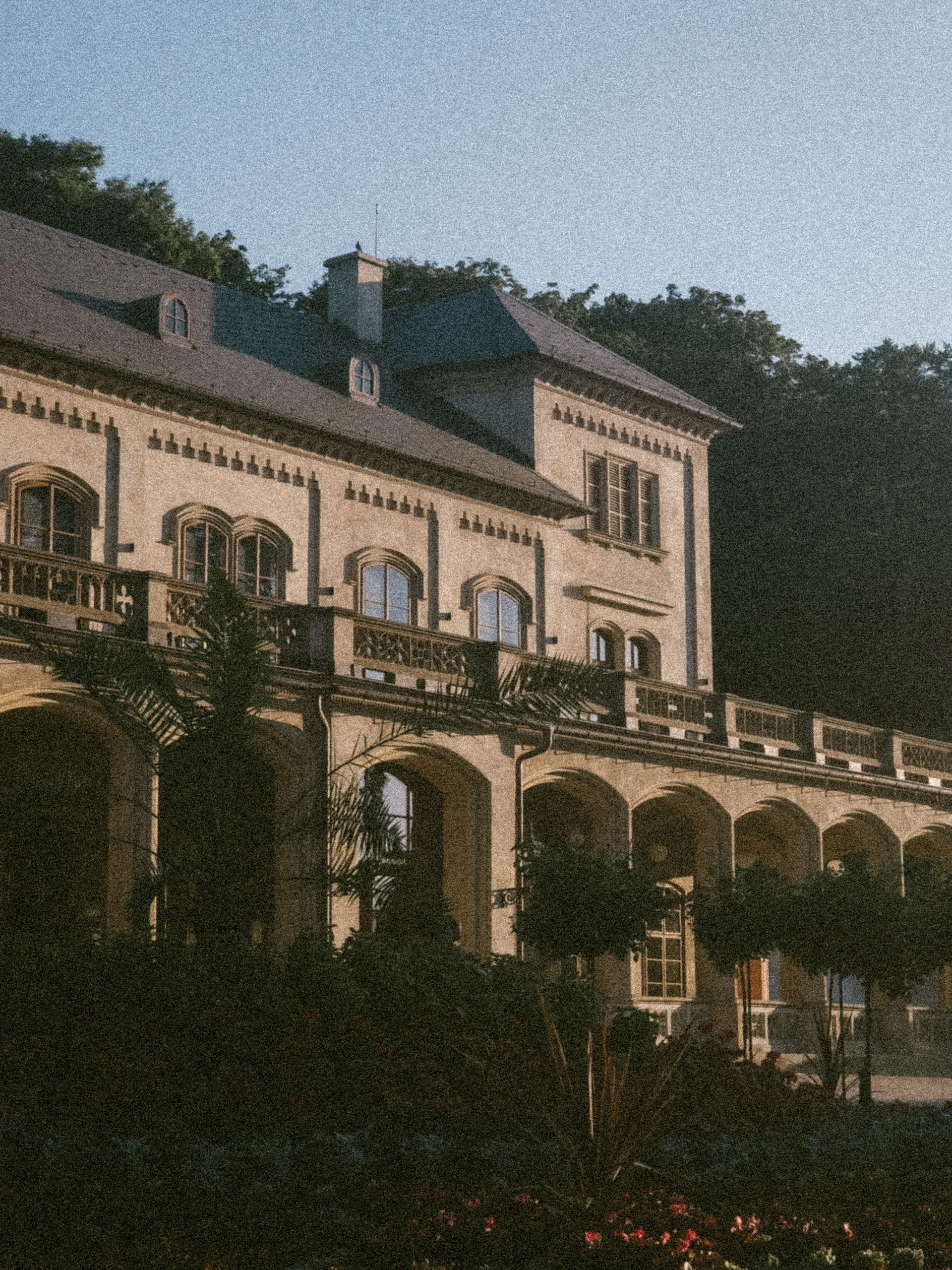 Stone manor facade with arched windows