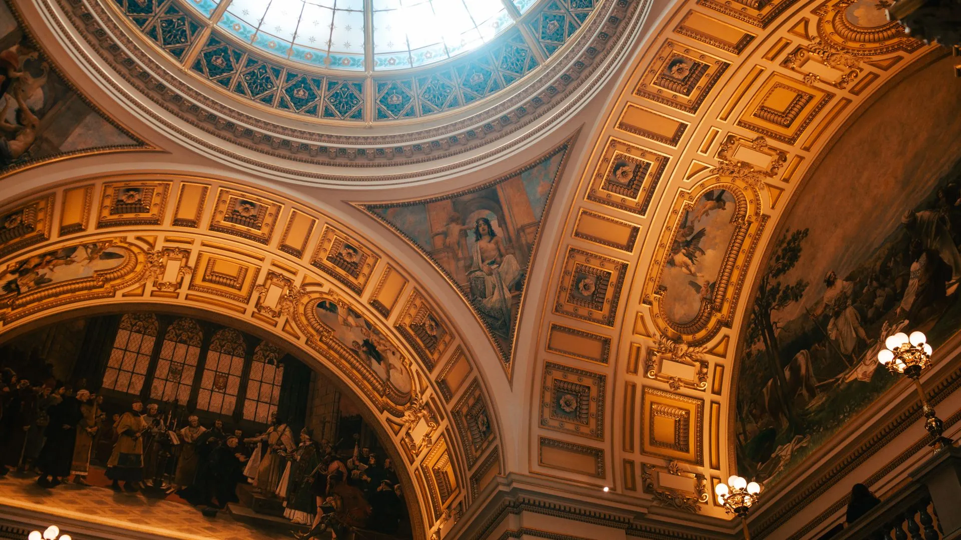 Historic library with curved bookshelves beneath a domed ceiling